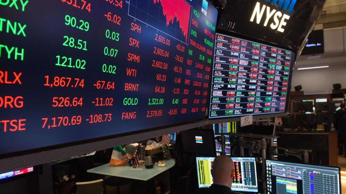 Stock indices and performance screens at the New York Stock Exchange (NYSE) reflecting the impact of Trump's tariffs on US stocks